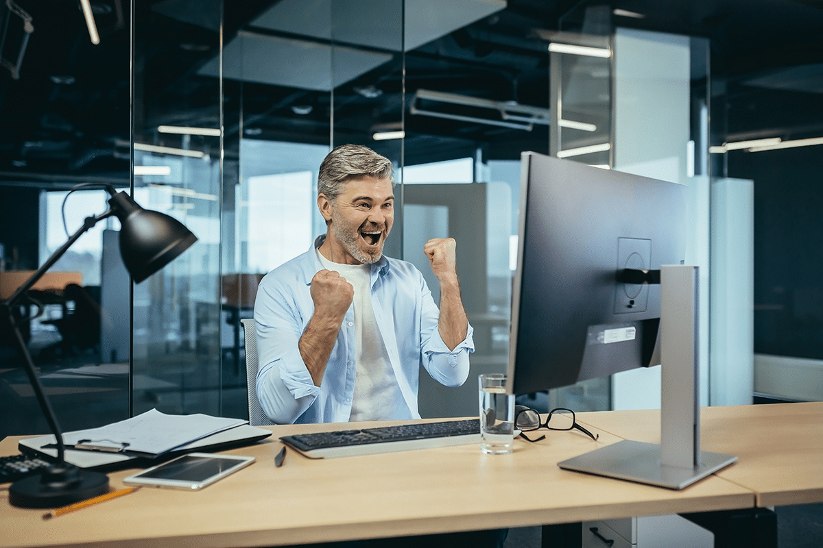 excited man at computer