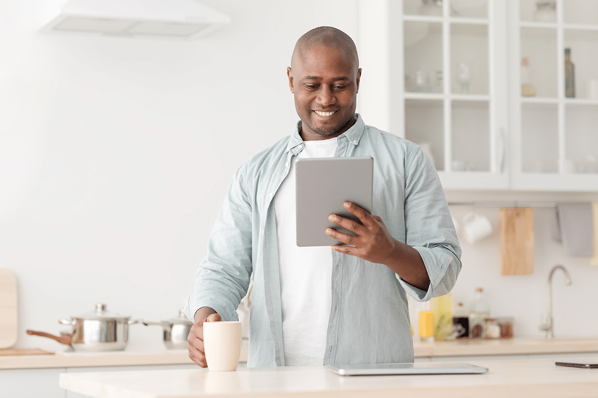 Man looking at OPM deadlines on tablet