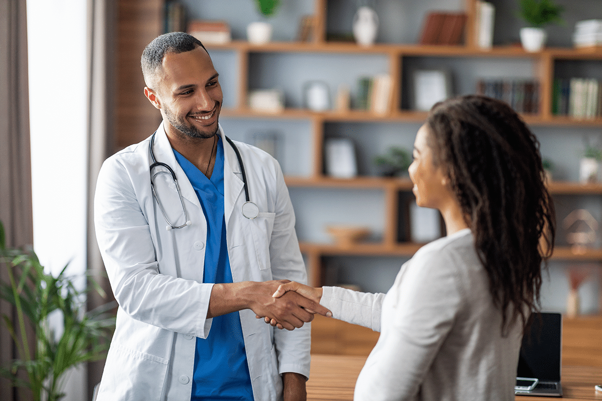 Doctor meeting with a federal employee to discuss health insurance options